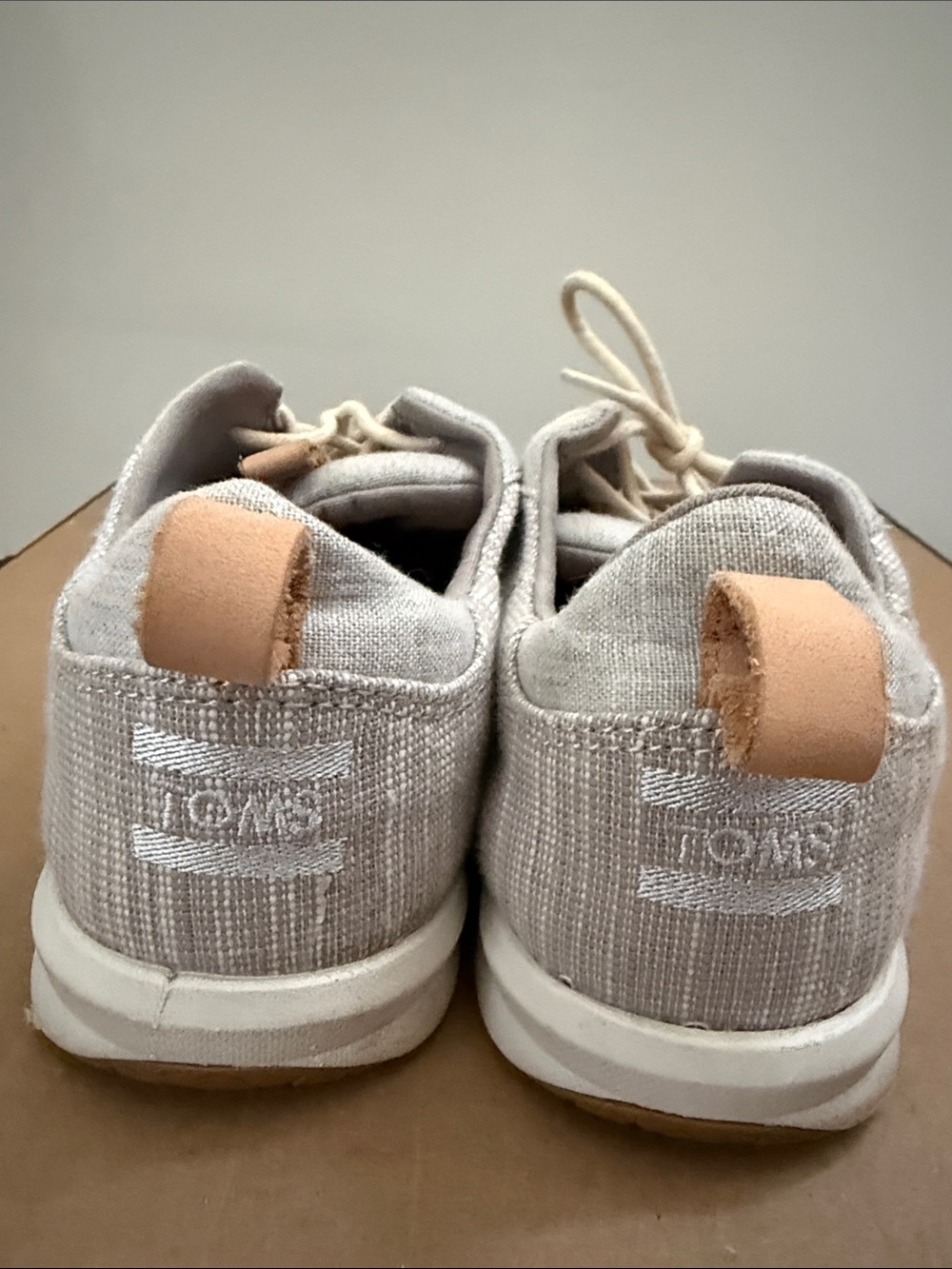 TOMS Low-Profile Slip-Ons in Light Beige with Tan Pull Tabs